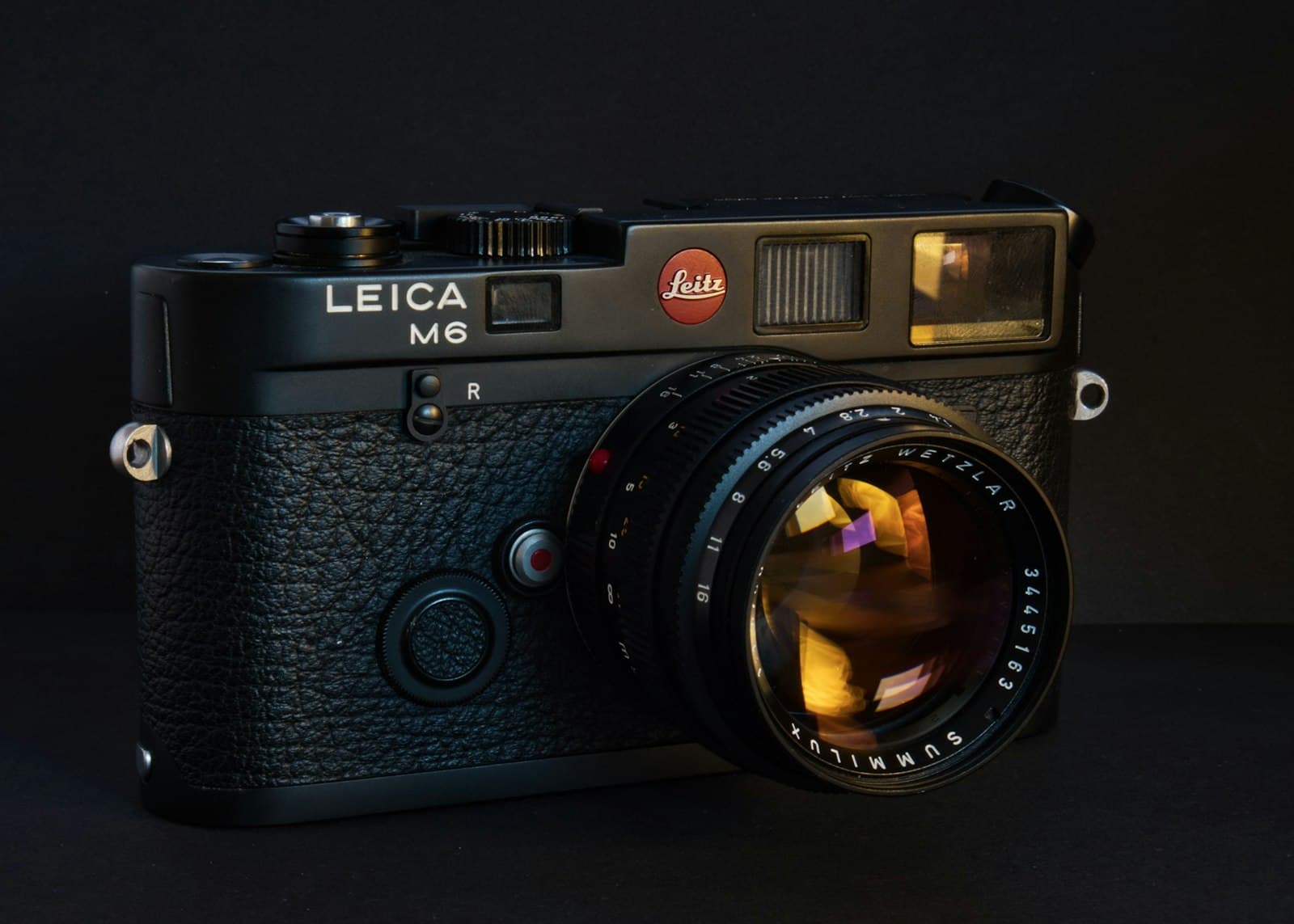 A black Leica M6 with a Summilux 50mm lens, listed as K-0398, with five flaws pinned
